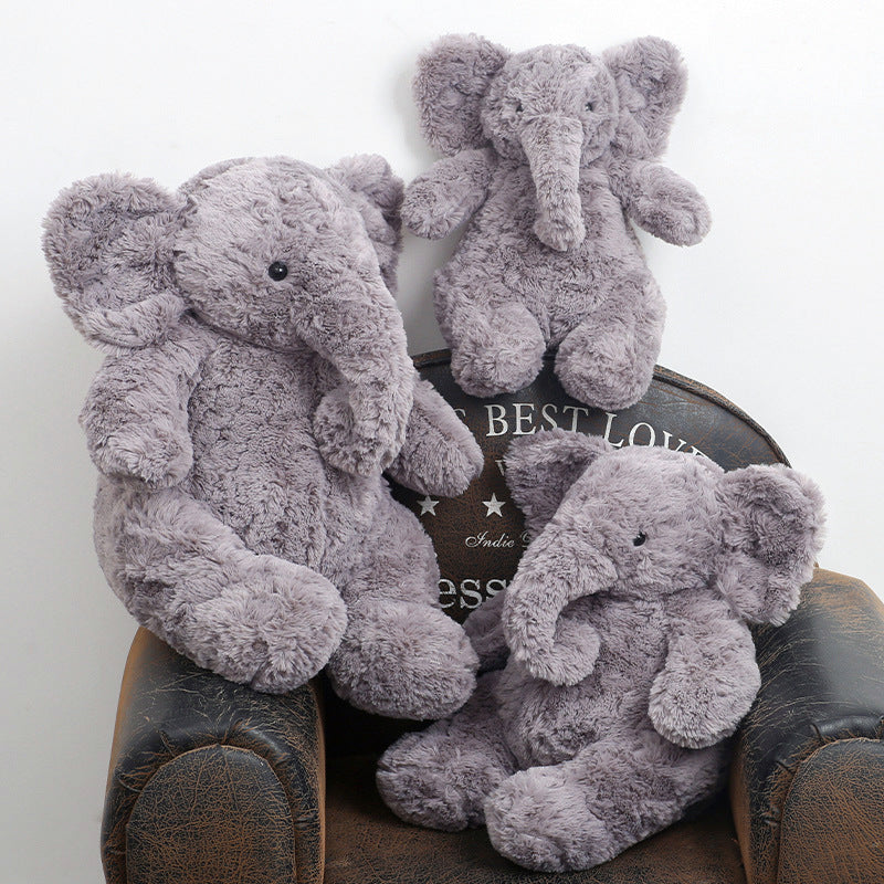 Fluffy Gray Elephant Plush toy.The sweet, floppy ears and curled trunk give it an adorable, timeless look that steals hearts instantly.Its fluffy, cloud - like fur is perfect for cozy snugglesâideal for both kids and adults seeking comfort.