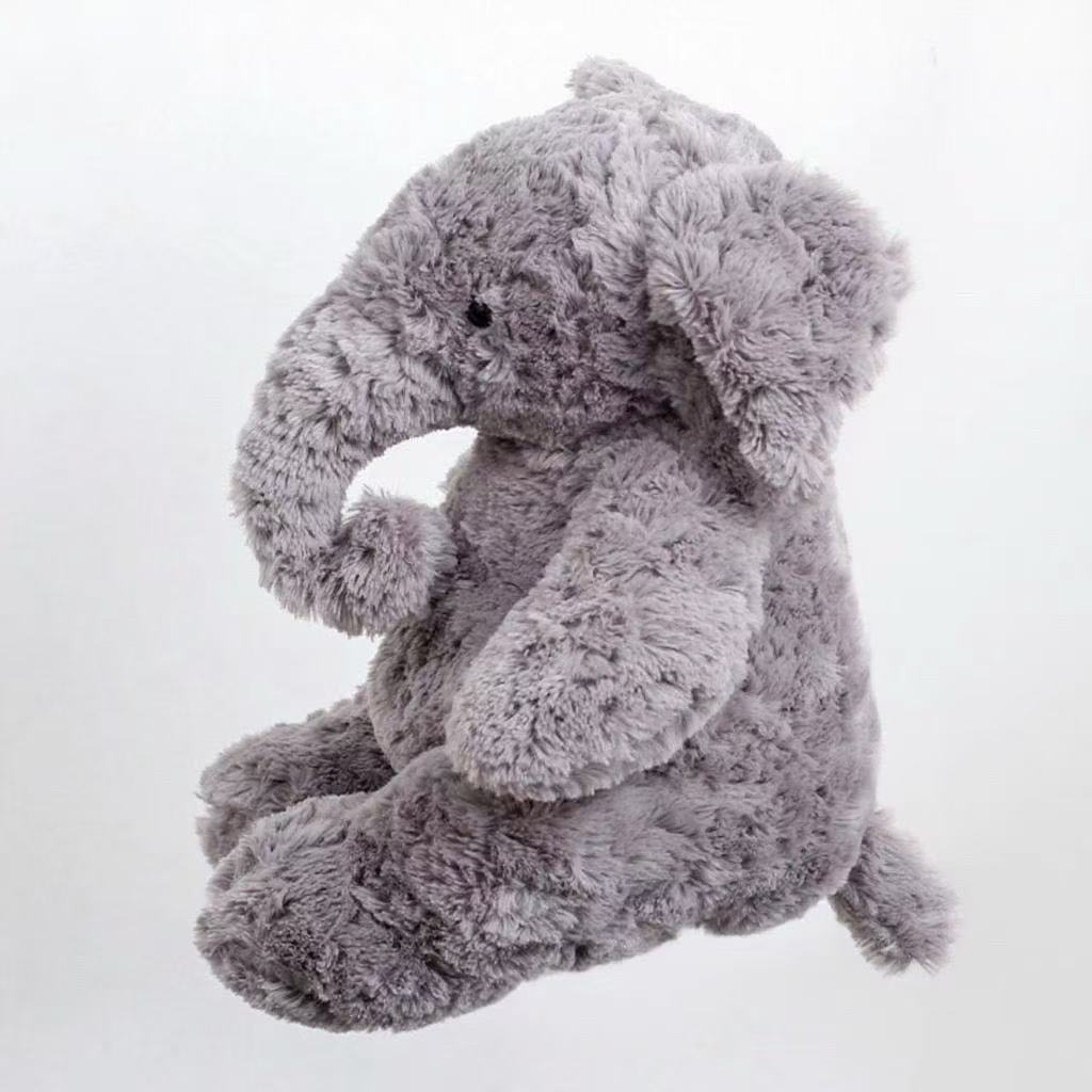 Fluffy Gray Elephant Plush toy.The sweet, floppy ears and curled trunk give it an adorable, timeless look that steals hearts instantly.Its fluffy, cloud - like fur is perfect for cozy snuggles—ideal for both kids and adults seeking comfort.
