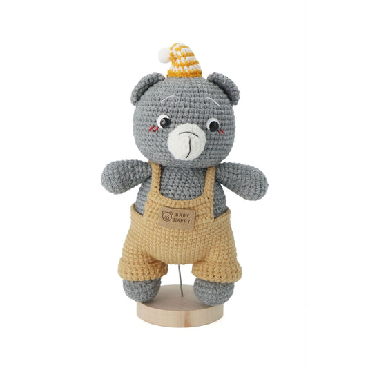 A hand-crocheted gray bear doll, paired with khaki overalls and a knitted hat.It does not require glue, is made of pure cotton, feels soft, is safe and environmentally friendly, and is no problem for babies to bite.