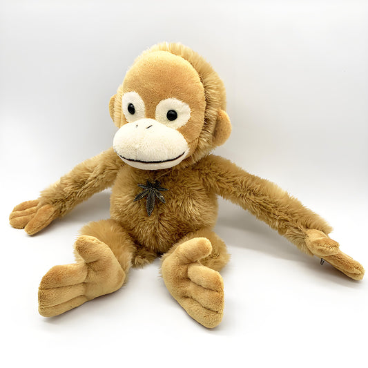 Adorable brown monkey plush toy, featuring a cute face, long limbs, and a leaf pendant on its chest, perfect as a kids' companion or decorative gift