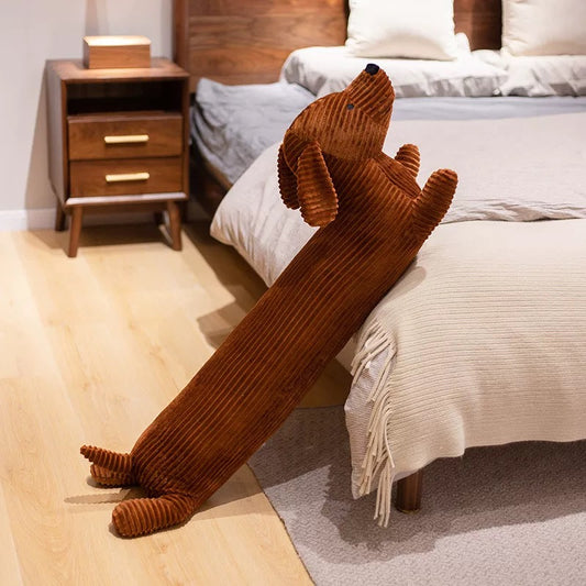 The brown dachshund plush toy has a long body, short legs, a reliable appearance, and corduroy material. You can always feel the warmth by touching the pillow at any time. It is the best choice for companionship and comfort.
